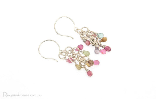 Colourful tourmaline gemstones wire wrapped in a long sterling silver earring