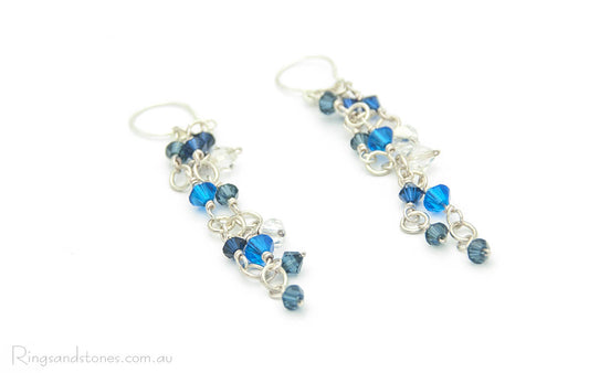 Blue Swarovski crystals long sterling silver earrings. Fashionable, big, long earrings with eye-catching sparkle.