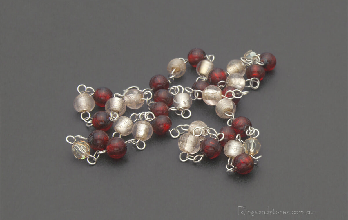 Sterling silver beaded necklace with red glass beads