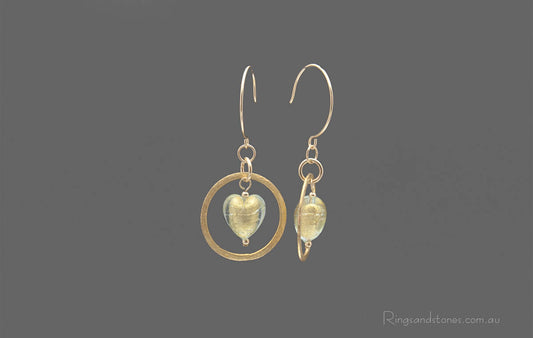 Gold hoop earrings with gold Murano glass hearts